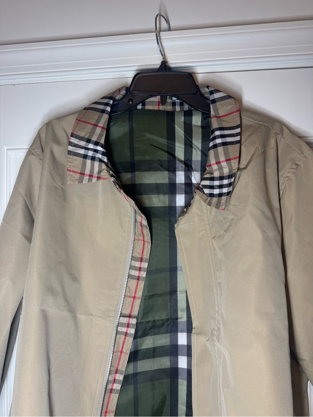 Beige Jacket with Plaid Lining. No Brand. 
23.5 inches Wide when Zipper Closed.